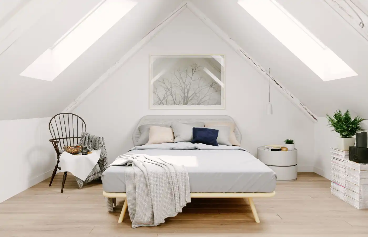 Chambre lumineuse et moderne aménagée dans des combles, avec fenêtres de toit et décoration minimaliste pour un espace confortable et fonctionnel.